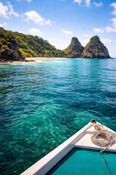 A view of Baia do Sancho and Morro Dois Irmãos from a boat, an alternative way to visit covered in our travel guide